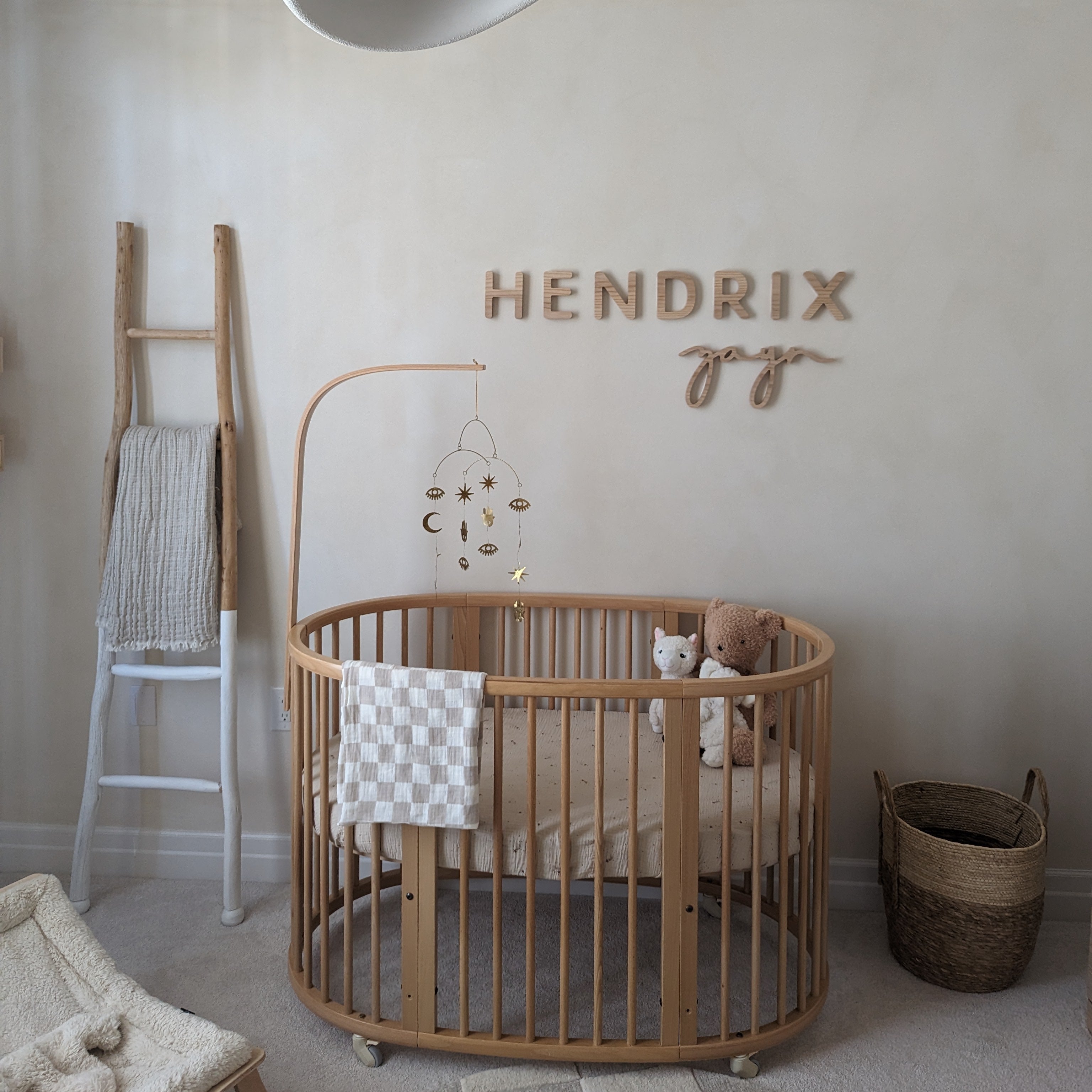 wooden name sign for a boy with neutral wooden accents