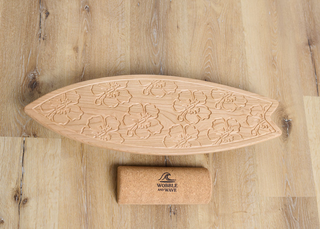 Solid cherry balance board engraved with a tropical hibiscus floral design. Functional for balance training and beautiful as decor.