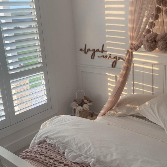 girl bedroom with wooden name sign