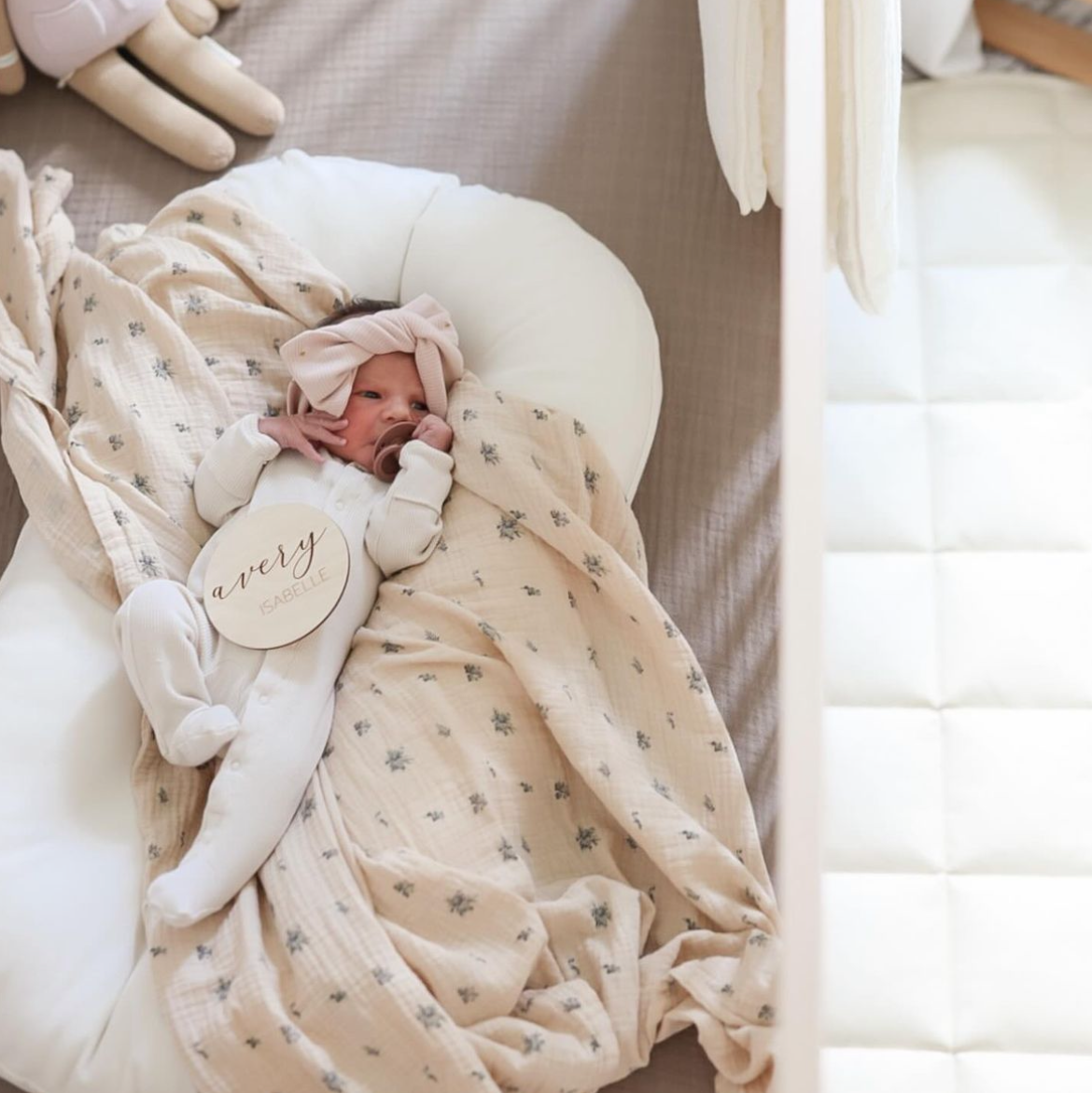 baby girl with her name round to announcement name