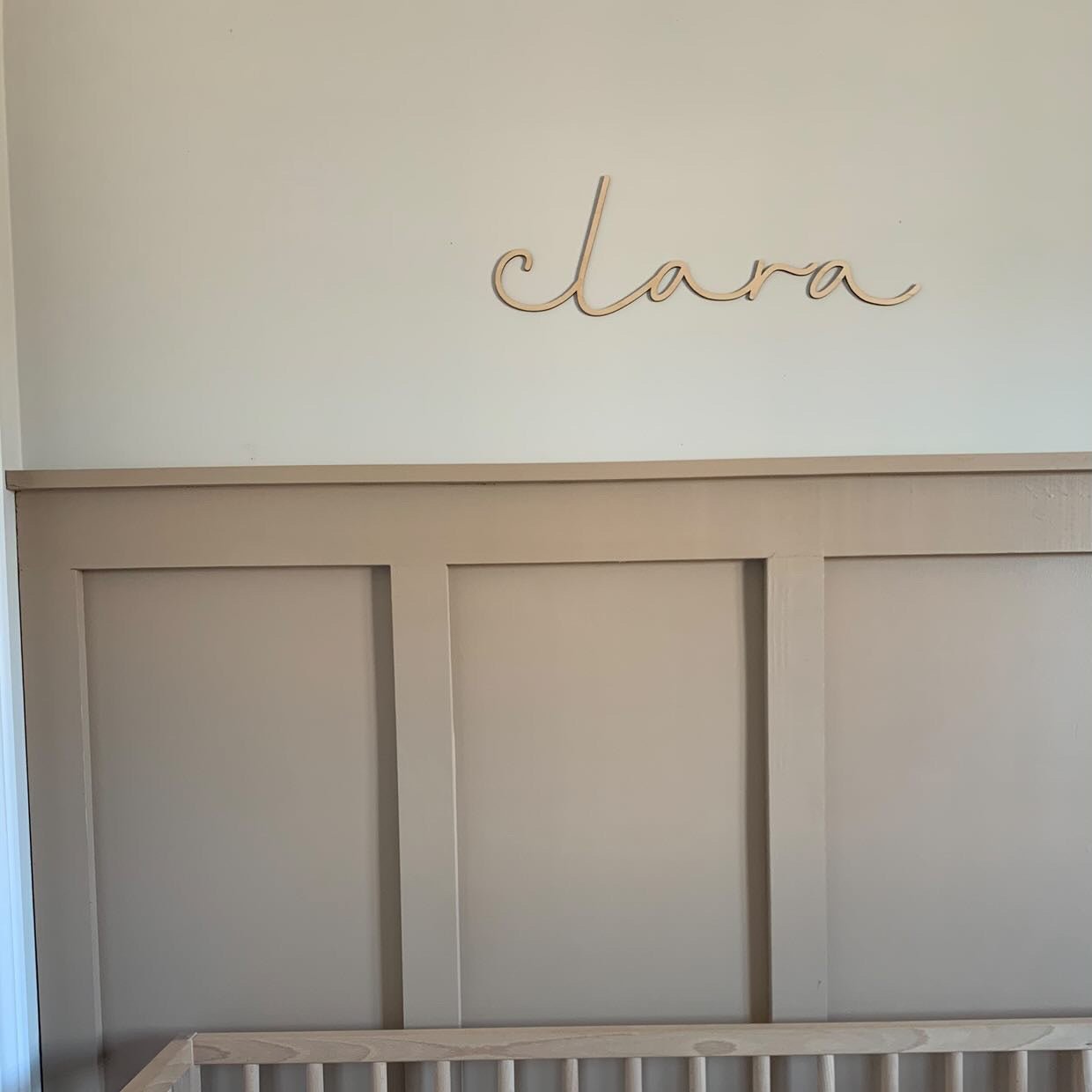 girl's nursery with wooden sign