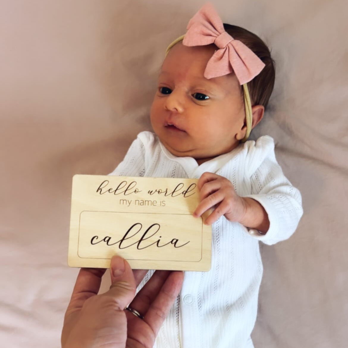 announce girl baby name with hello world plaque