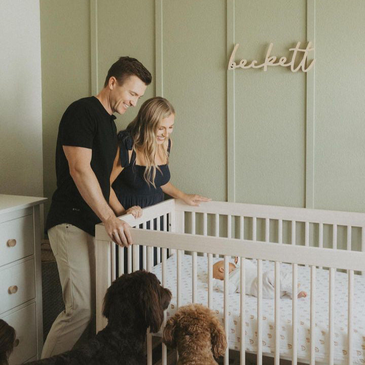 green boy nursery with wooden name sign
