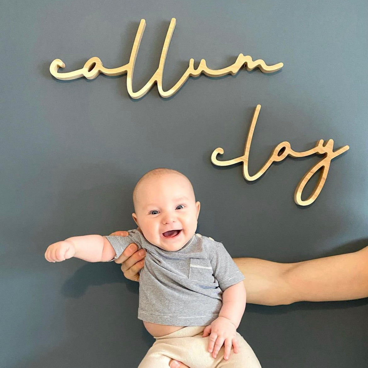 boy newborn photography with name sign