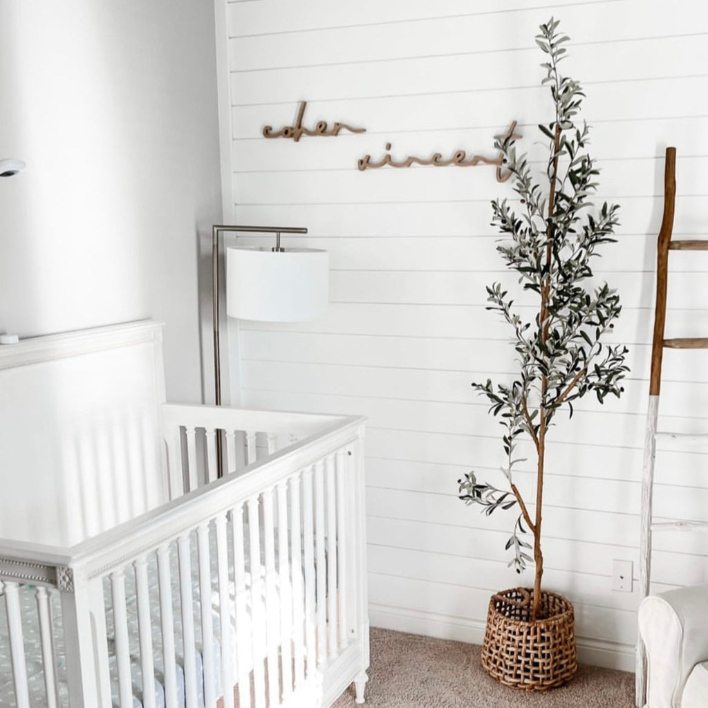 boy nursery with wooden accent in name sign