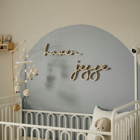 boy nursery with blue arch and name sign