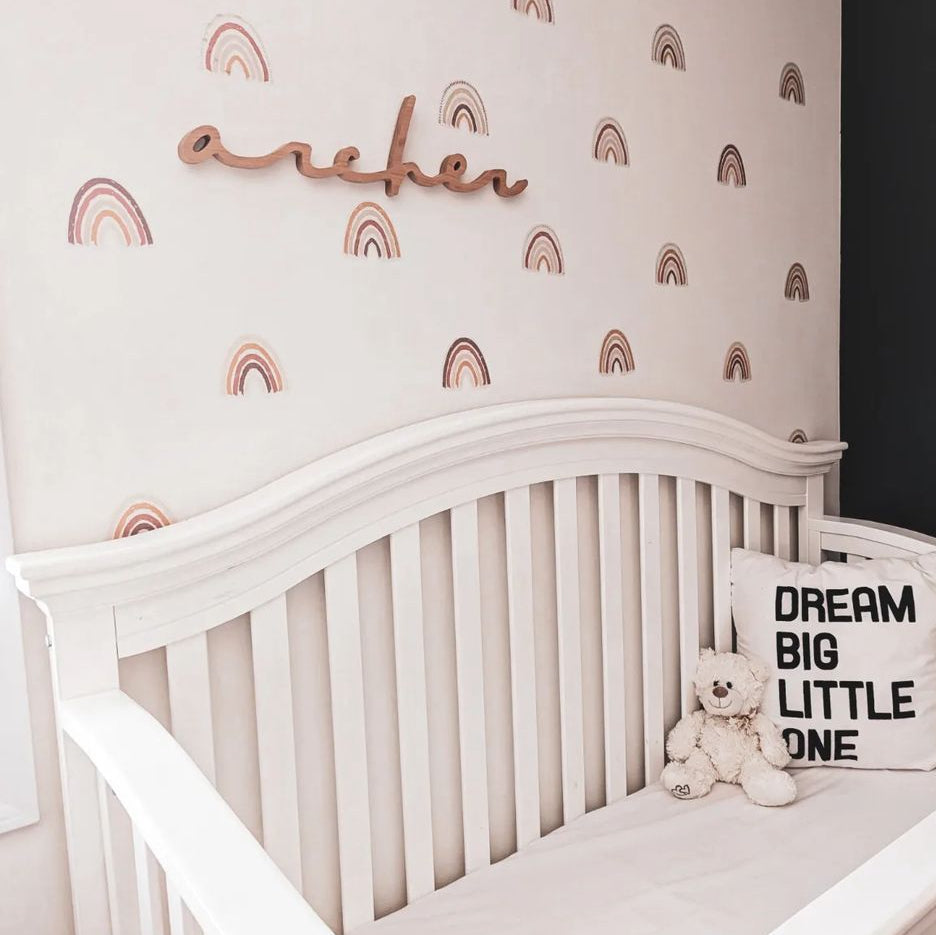 boy nursery design with cherry wooden name sign