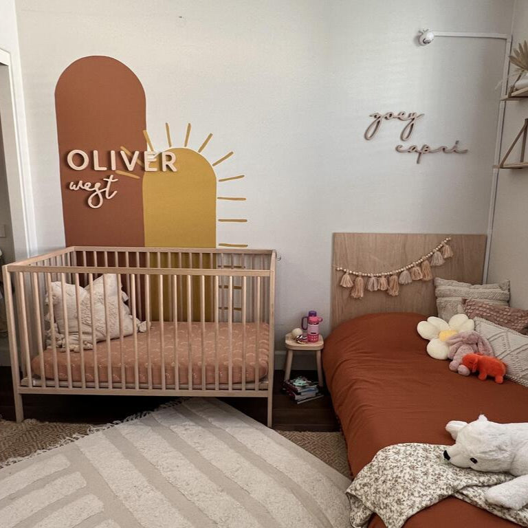 boho nursery theme in shared bedroom for boy and girl