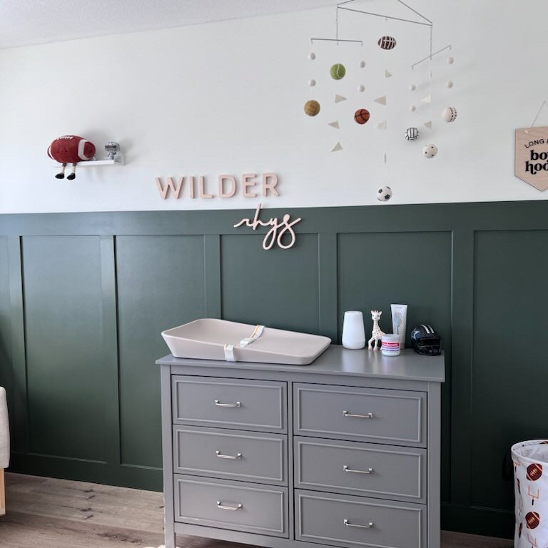 green board and batten boy nursery with wooden name sign 