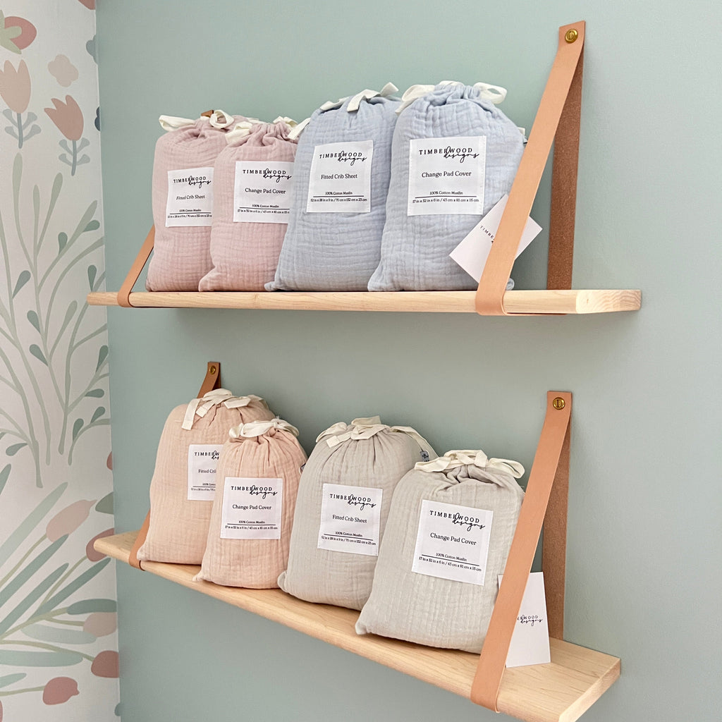 Three wooden shelves with small bags labeled on a light gray background