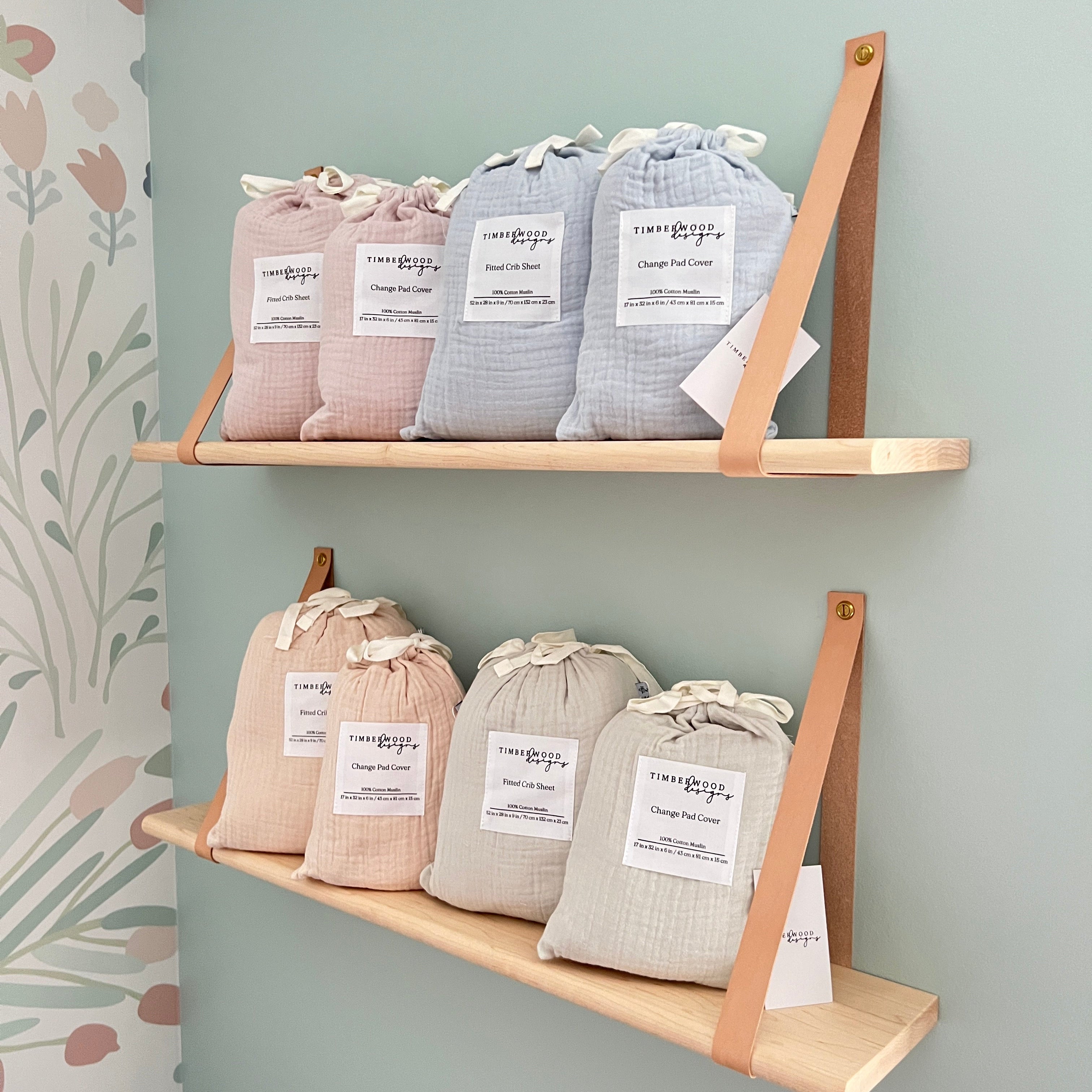 Three wooden shelves with small bags labeled on a light gray background