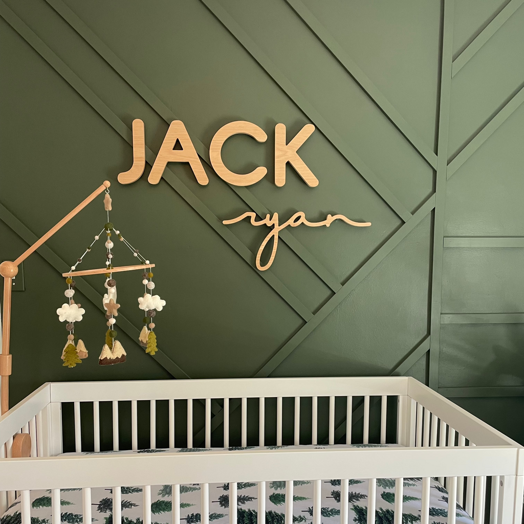 green boy nursery with wooden name sign 