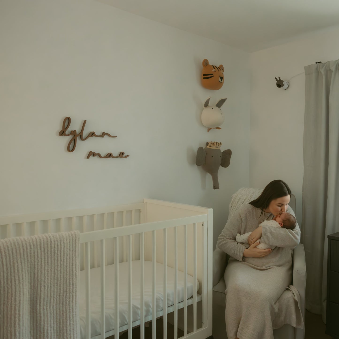 walnut name sign in girl nursery with animal decor