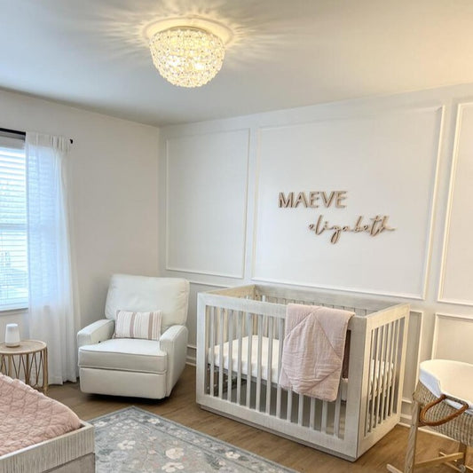 Girl nursery with wooden name sign