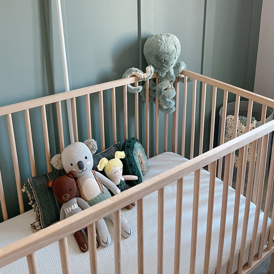 green cotton muslin crib sheets in boy nursery