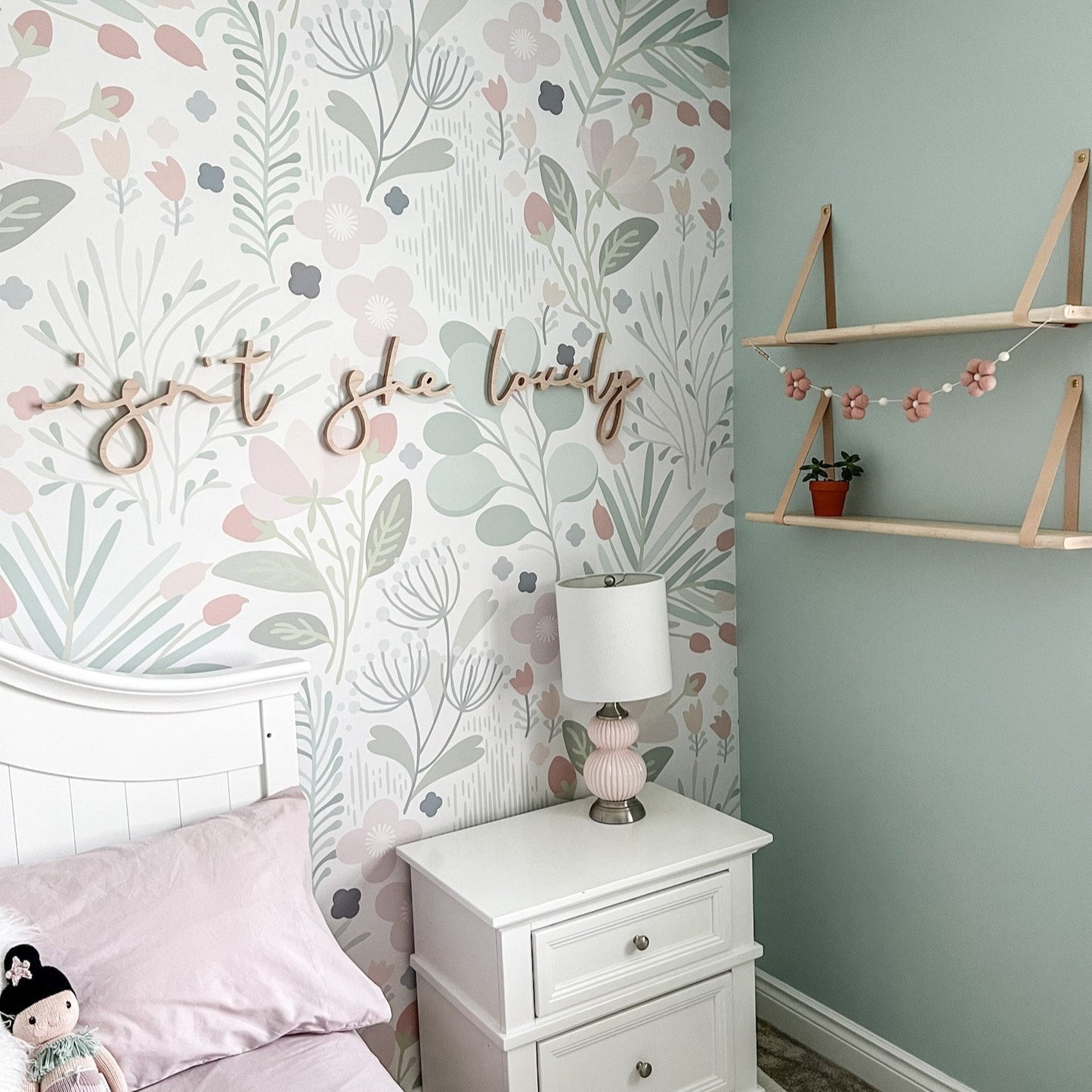 big girl room design with wallpaper and a custom phrase