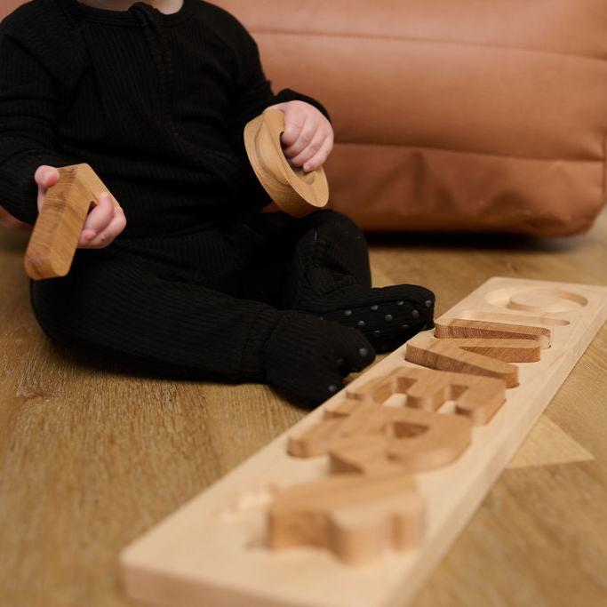 wooden namepuzzle with chunky pieces