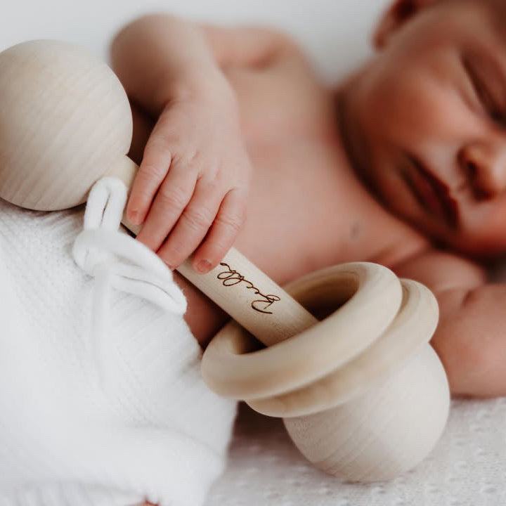 Newborn Photo with Baby Rattle